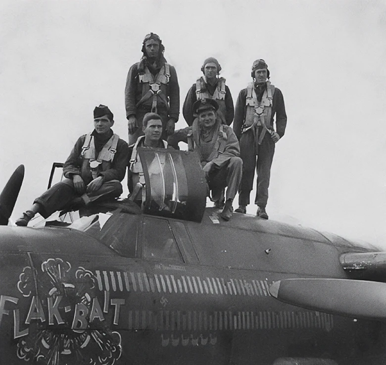 Lt. Farrell (front row, kneeling) and his crew pose on Flak-Bait shortly before the Normandy Invasion