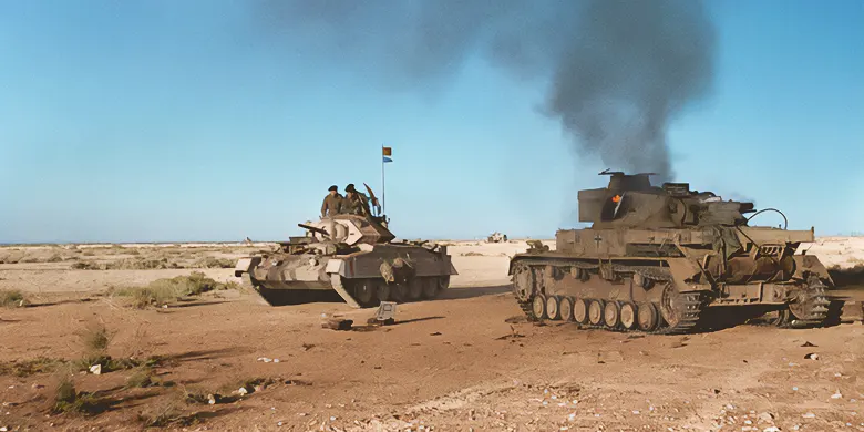 A British Crusader tank passing a burning German Panzer IV during Operation Crusader, late 1941
