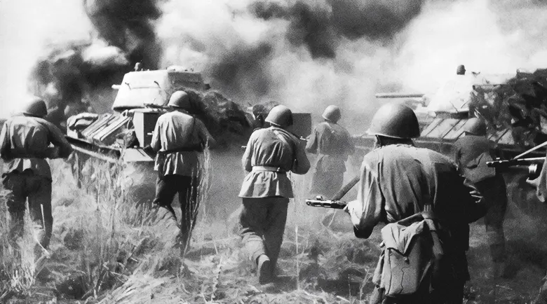 Soviet infantry advancing behind tanks near Prokhorovka, July 12, 1943