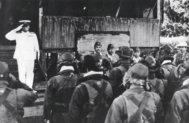 Admiral Yamamoto, a few hours before his death, saluting Japanese naval pilots at Rabaul, April 18, 1943