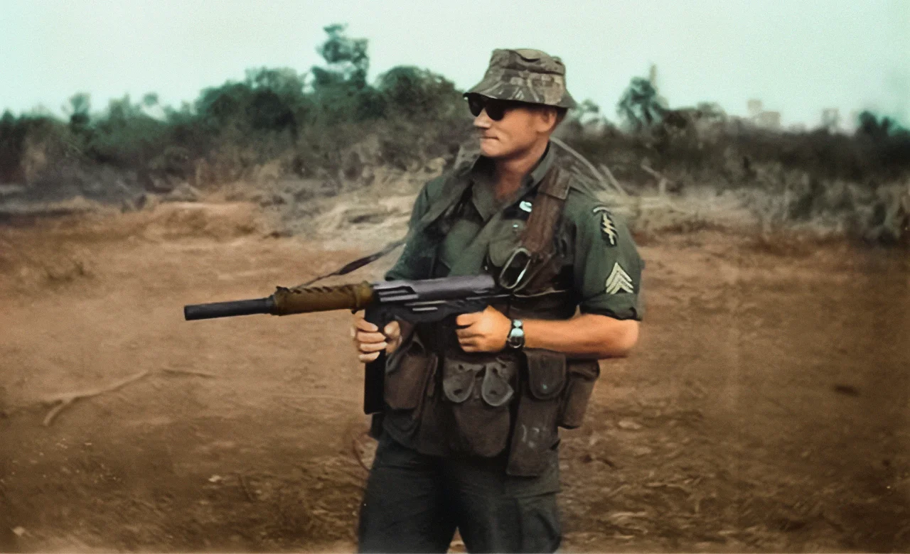 US Special Forces sergeant shows off his suppressed M3 Grease Gun in Vietnam