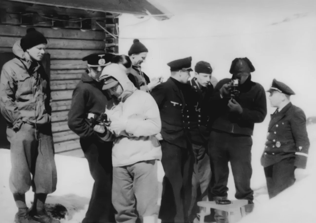 Wilhelm Dege (wears the white anorak) with his unit learns to use a sextant at the Goldhöhe training camp