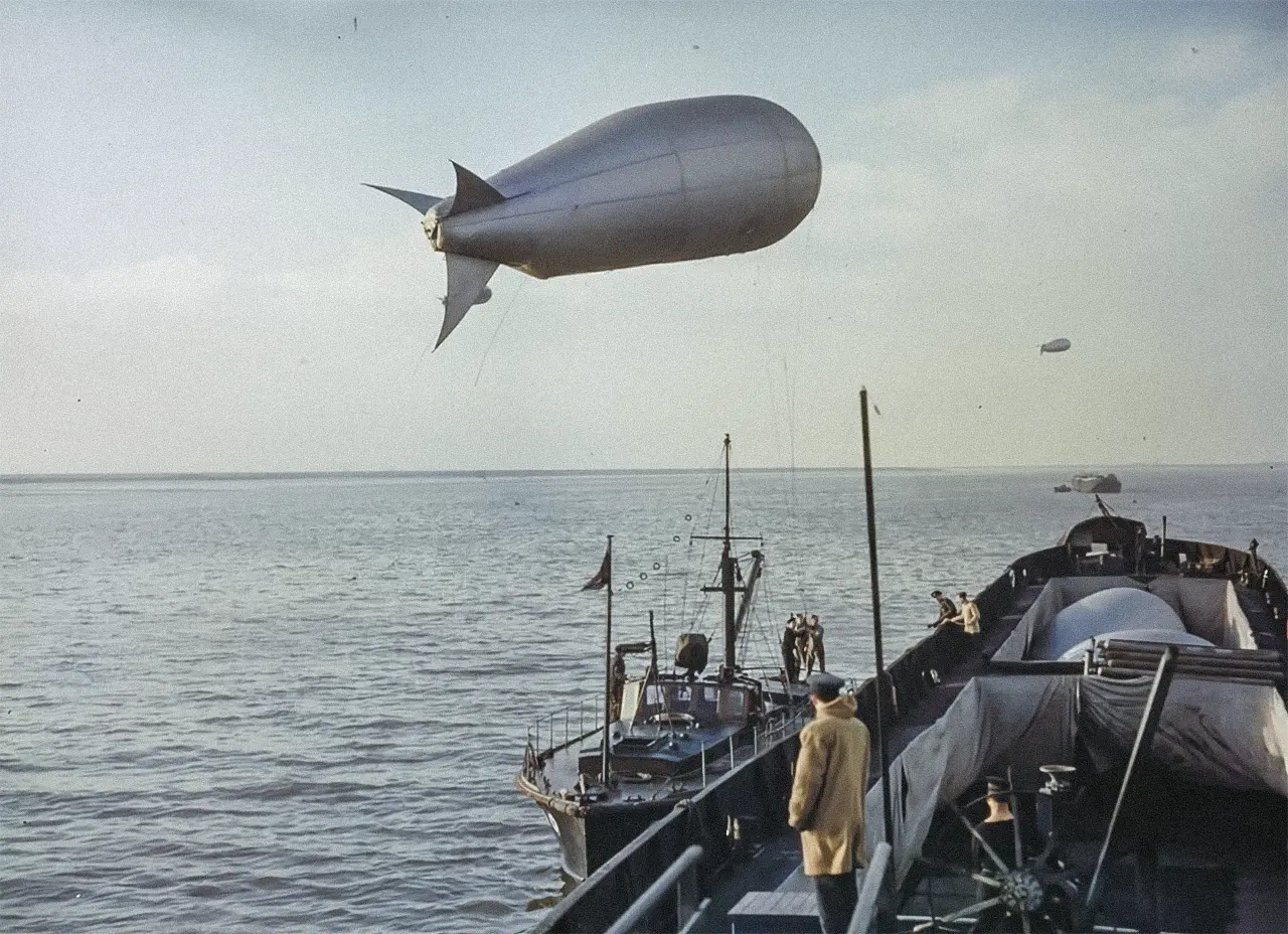 Marines pulling a barrage balloon from a barrage balloon vessel